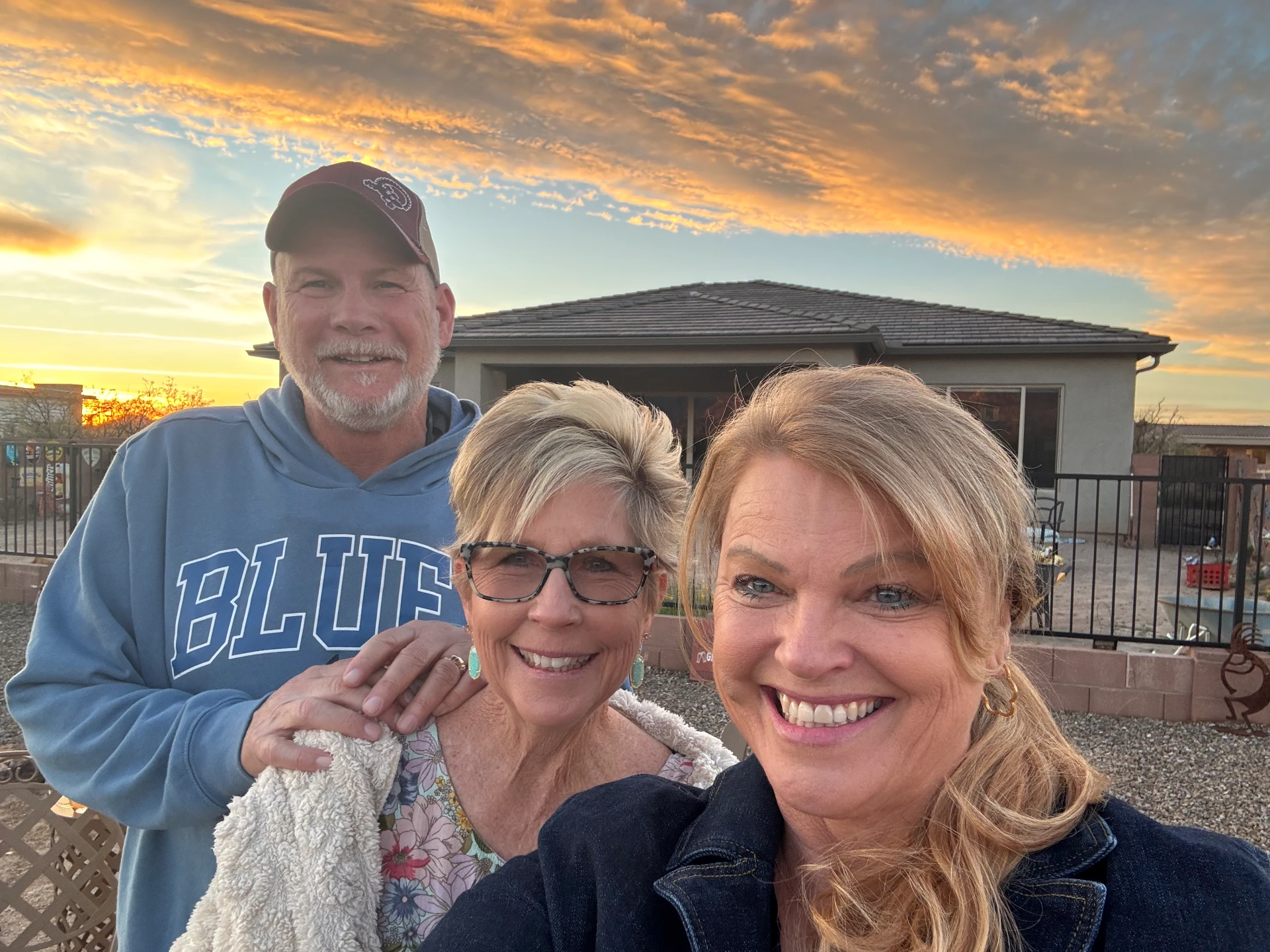 Sheila Chonis with Joan and Steve C. outside their new home